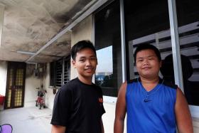 HEROES: David Laxamana (left) and Marcus Tan (right) were playing basketball when they noticed thick smoke billowing from the third storey of a nearby HDB block.