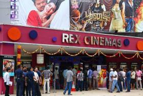 BLOCKBUSTER: The crowds queueing to buy tickets to see the movie Kaththi at Rex Cinemas on Mackenzie Road (above) and the Golden Cinema at Golden Mile Tower.