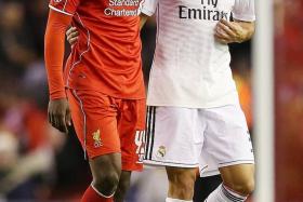 BEFORE: Balotelli consoled by Pepe at half-time.