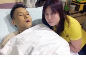 Mrs Serene Koh by her ailing husband Jason Mah&#039;s bedside. 