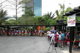 LONG QUEUE: (Above) The queue at the pop-up store.