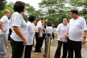EXASPERATED: Family members of Mr Soh Kang Gee at Mandai Crematorium.