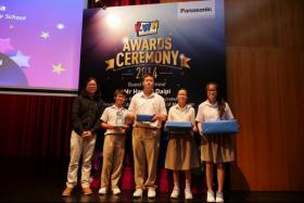 Clementi Town Secondary School receiving The Clipper Award (for best editing) from judge, Mr Nicholas Chee, Executive Creative Director of The Flying Kick Asia 
