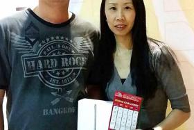 CHRISTMAS COMES EARLY: Mr Tan Chong Kheng intends to give the iPad Mini 3 to his girlfriend, Miss Evelyn Kam.