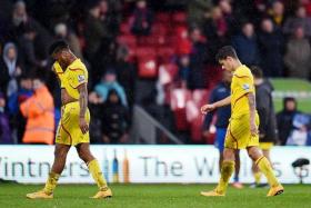 WOEFUL: Liverpool's Raheem Sterling (left) and Philippe Coutinho looking dejected at the end of the match against Crystal Palace.  