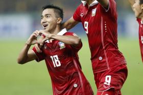 Chanathip Songkrasin celebrates after scoring Thailand&#039;s second goal against Malaysia.