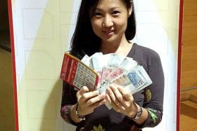 BIG WINNER: Madam Helen Teo Sock Kuan with the $9,000 jackpot prize.