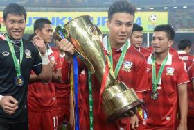 Charyl Chappuis holds the Suzuki Cup.