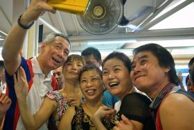 SELFIE: Prime Minister Lee Hsien Loong at an event in Ang Mo Kio on Saturday. 