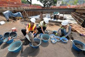 Volunteers for NSC-ISEAS have to work fast as urban development is encroaching on the excavation site.