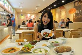 FEAST: Suria actress-host Nurul Aini eating at Encik Tan Popiah Oyster omelette Fried carrot cake