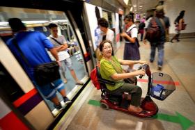 CONVENIENT: The mobility scooter allows Madam Elsie Tan to move about on her own without having to rely on her husband.
