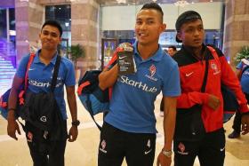 MIDDLE MEN: (From left) Midfielders Firdaus Kasman, Isa Halim and Izzdin Shafiq, arriving at their hotel in Kuantan yesterday, have pleased LionsXII coach Fandi Ahmad with their improvement.