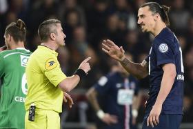 Zlatan Ibrahimovic speaks with a referee on Wednesday during a French Cup semi-final between Paris Saint-Germain and Saint-Etienne