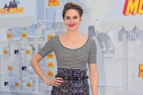 Actress Shailene Woodley poses on arrival for the 2015 MTV Movie Awards on April 12, 2015 in Los Angeles, California.