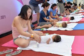 HAPPY: Mothers bonded with their babies while learning how to massage them.