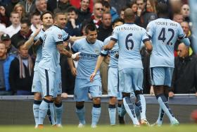 Manchester City&#039;s Sergio Aguero celebrates scoring their first goal 
