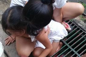 HURT: The girl suffered bruises and swelling on her left knee after her leg was stuck in the drain grate for 30 minutes.
