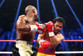 Floyd Mayweather and Manny Pacquiao box during their world welterweight championship bout at MGM Grand Garden Arena.