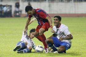 PAINFUL MEMORY:  Former LionsXII players Shahril Ishak (left) and Hariss Harun (right) suffered the agony of missing out on a place in the final, after their penalty shoot-out defeat by ATM.  