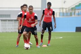 DANGERMEN: LionsXII defender Madhu Mohana (right) and his teammates need to be wary of the threat from Terengganu&#039;s Paulo Rangel  and Norshahrul Idlan Talaha.