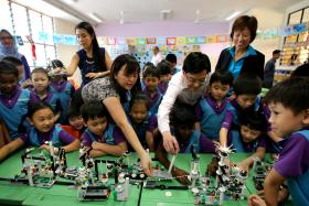 MASTERPIECE: Minister Heng Swee Keat (in white) looking at the Lego creations of Primary 2 pupils at West Spring Primary.