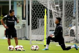 MENTOR: LionsXII goalkeeping coach Lee Bee Seng (left) says Izwan Mahbud (right) has become better at communication with his teammates.  