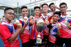 WINNERS: Darrin Daniel and his Magnum 1  team (above) edged out tournament top-scorers Nek Chullos 1-0 in the final of the Berita Harian National Futsal Championship.