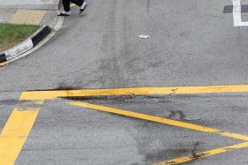ACCIDENT SCENE: Bloodstains on the road where the elder Mr Ng was knocked down. 