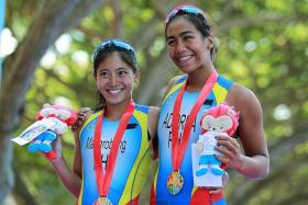 PINOY POWER:  It&#039;s a one-two finish for the Philippines, as Claire Adorna (right) and Kim Mangrobang clinch the gold and silver respectively.