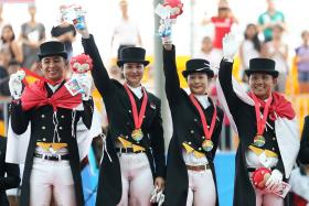 TEAMWORK: The Indonesia team, led by Larasati Gading (second from right) celebrating with their gold medals.