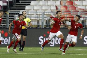 Indonesia players celebrating a goal during their game against Cambodia on June 6. 