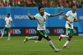 Indonesia&#039;s Evan Dimas celebrates after scoring against Singapore during the group stage of the SEA Games football tournament.