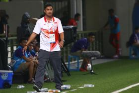 Aide Iskandar, walking the touchline when Singapore took on Indonesia. He announced after the games that he was walking away from the role as coach. 