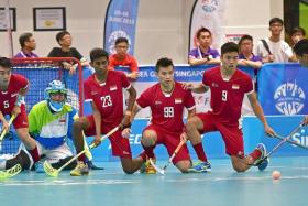 DOMINANT START: Singapore floorball men and women&#039;s teams (in red) prove too mighty for rivals the Philippines and Malaysia respectively.
