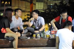 Bottoms up: Young people drinking on Read Bridge in Clarke Quay in 2012.