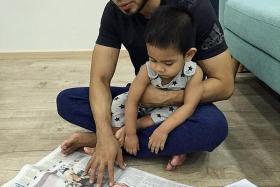 MINDFUL: Mr Najib Siddik, with his son Aadam, two. He hopes parents will be mindful of kitchen safety.