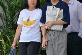 FREE: Amos Yee walked out of court a free man yesterday. He was accompanied by his parents, Madam Mary Toh and Mr Alphonsus Yee.