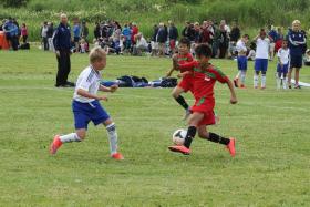 ATTACKING FORAY: (From right, in red) F-17 Under-11 forward Aryan Bahadur Chetri and Russell Tan attacking IFK Stocksund at the Gothia Cup.