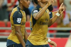AKPOM WITH APLOMB: Arsenal&#039;s Chuba Akpom (near left) celebrating one of his three goals last night. 