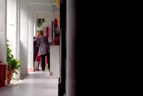 Screen grab from video showing a woman being slapped by her daughter.