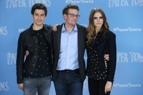Author John Green (C) and Cast Members Nat Wolff (L) and Cara Delevingne at a photo call promoting their film Paper Towns at Claridges in London
