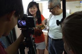 RECIPE FOR FRIENDSHIP: Neighbours Rachel Hoon (left) and Mr Mahmood Maricar being filmed by the My Singapore Food team.