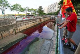 Residents at Jurong West were shocked at the sight of blood-red water flowing in the canal on Saturday (July 26).