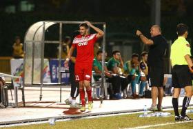 ANGRY TIGERS: Balestier&#039;s Miroslav Kristic (in red) walking off after being controversially sent off, leaving his coach Marko Kraljevic (in black) fuming. 