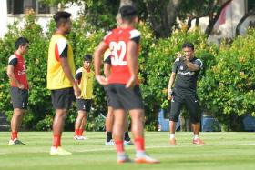 BOOST: LionsXII coach Fandi Ahmad (far right) and his charges can take confidence from beating Pahang, who were on a 12-match unbeaten run, ahead of their match with JDT.