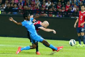 IN VAIN: JDT grabbed all three points through a superb effort by Luciano Figueroa (right).