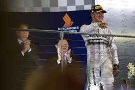 BACK TO BACK: Lewis Hamilton (above) will be hoping to repeat his victory at the Singapore Airlines Formula One Singapore Grand Prix last year.
