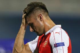 Arsenal were reduced to 10 men after Olivier Giroud was sent off in the 40th minute of their Champions League clash with Dinamo Zagreb.
