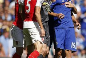 FLASH POINT: Diego Costa (near left) clashing with Gabriel Paulista (No. 5) before the latter&#039;s sending-off, an incident which changed the outcome of the game.
